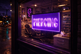 Neon sign indicating 'Piercing' in a dark setting, likely a piercing shop exterior.