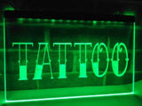A rectangular LED sign with the word 'Tattoo' illuminated in green, showcasing a tattoo parlor advertisement.