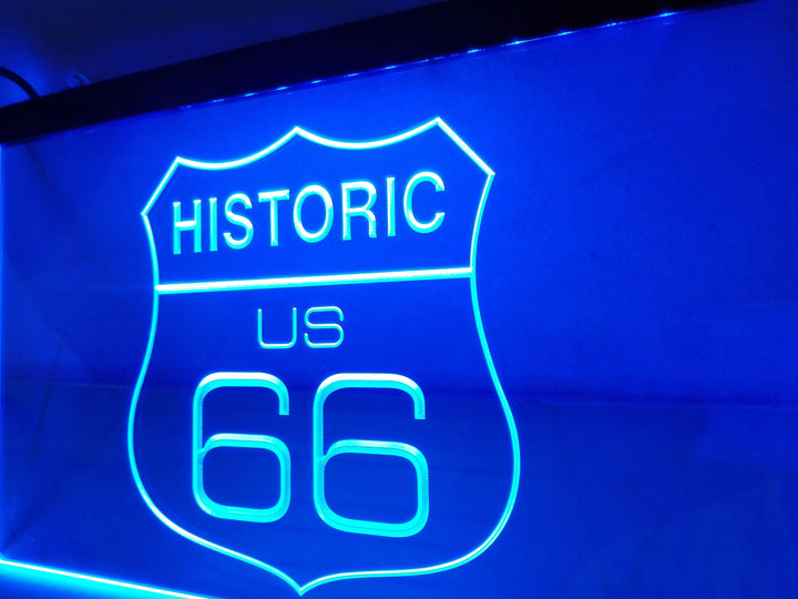 Blue Historic US Route 66 shield LED sign lit up, seen from an angle